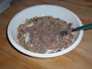 mash sardines with a fork