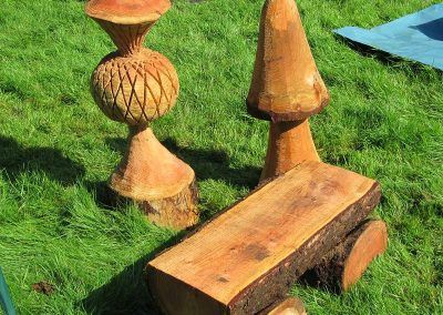 Chainsaw carved bench, thistle and mushroom
