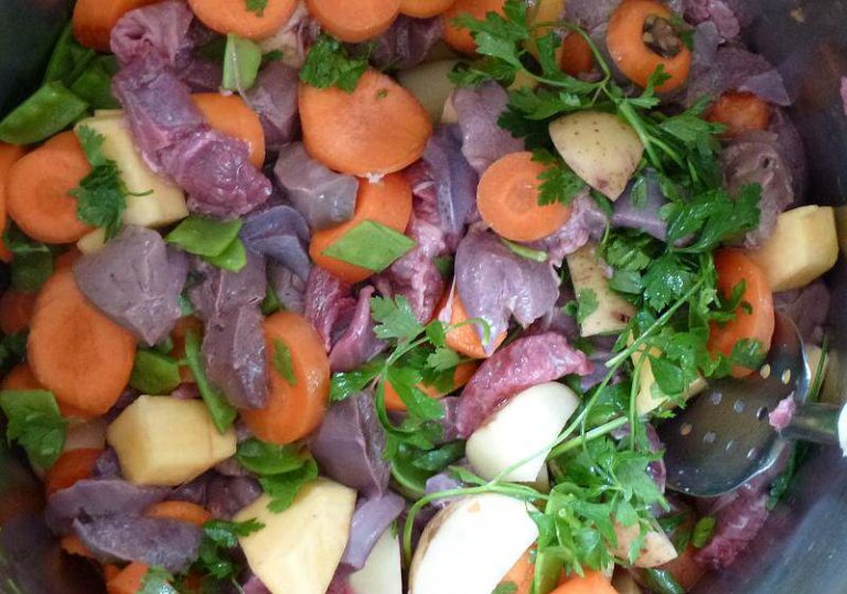 Add a cup of water, a couple of tablespoons of olive oil and a handful of chopped parsley.
