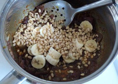Add the fruit and nuts to the coronation chicken