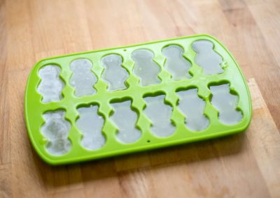 jelly baby mould filled with broth