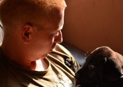 holding a puppy labrador