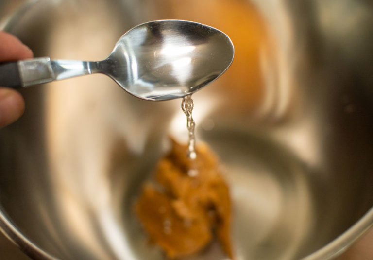 adding hot water to mixing bowl