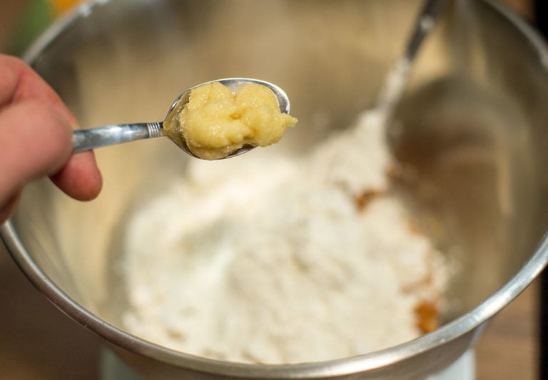 adding ginger to mixing bowl