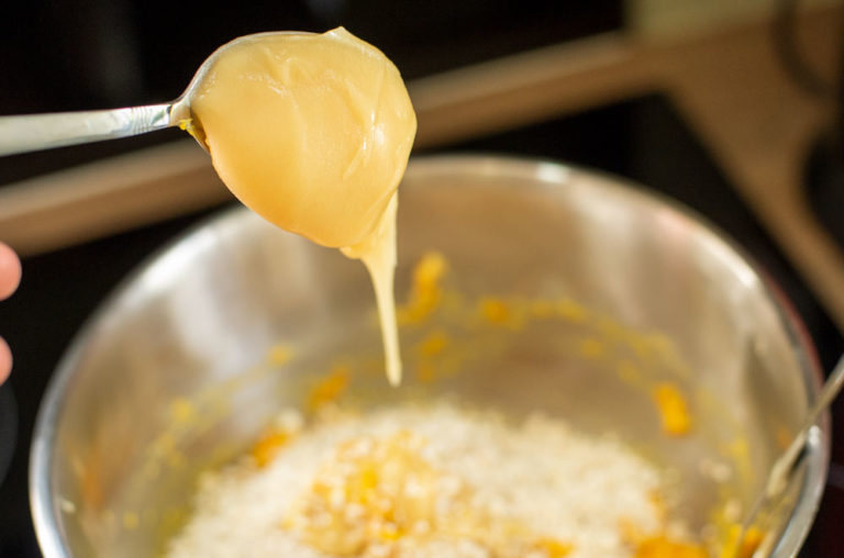 adding honey to mix bowl
