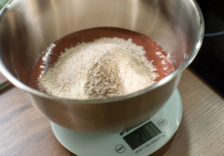 adding flour to liver cake mix