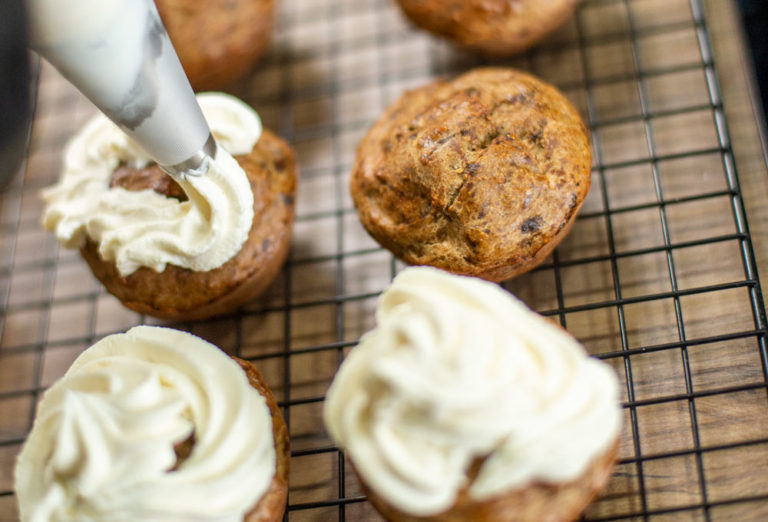 adding frosting to doggy cupcakes