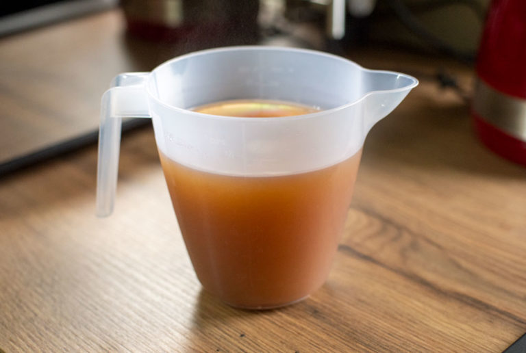 chicken stock in a jug