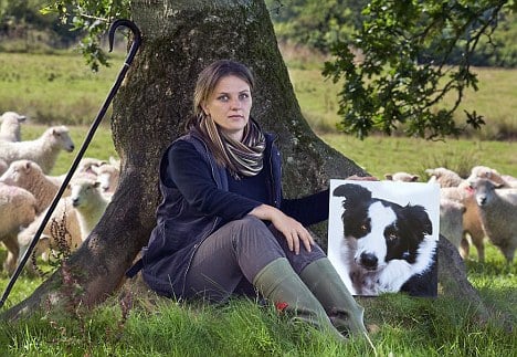 Rebecca Hosking, with a picture of her collie Dave