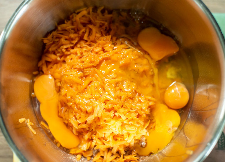 adding 4 eggs to mixing bowl