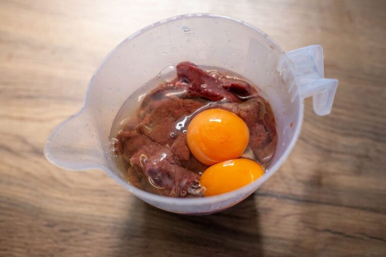 liver, eggs and milk in a measuring jug