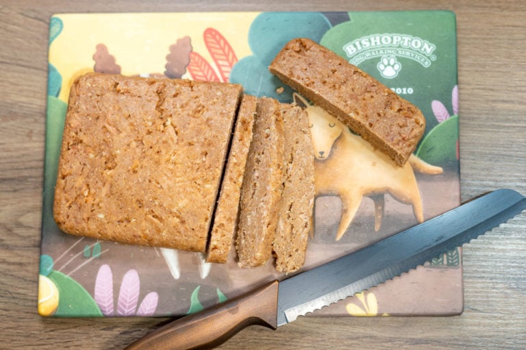 chopping up dog cake